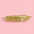 Barrette à cheveux - plume dorée