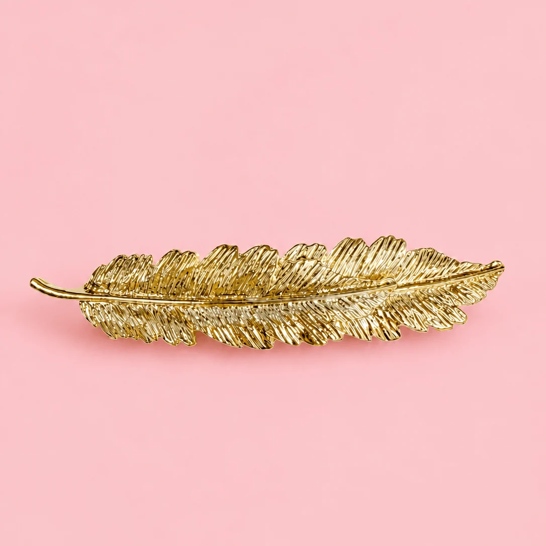 Barrette à cheveux - plume dorée